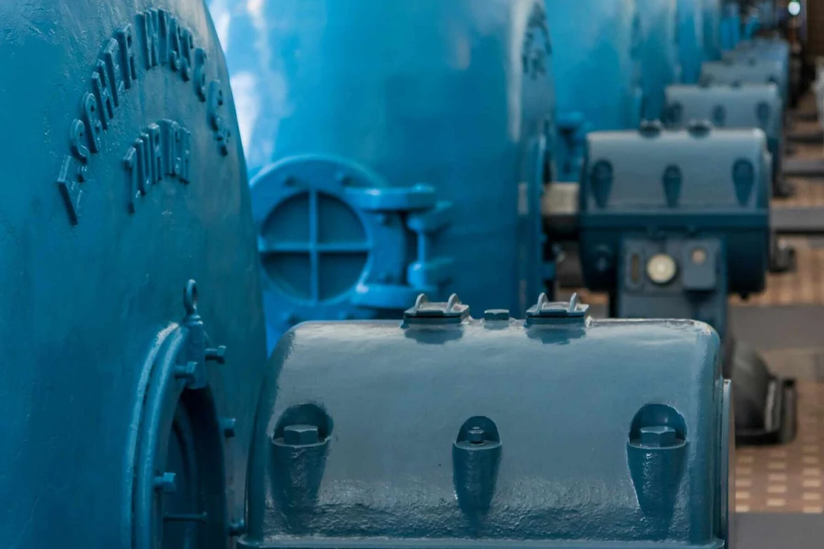 Row of large industrial machines inside a facility